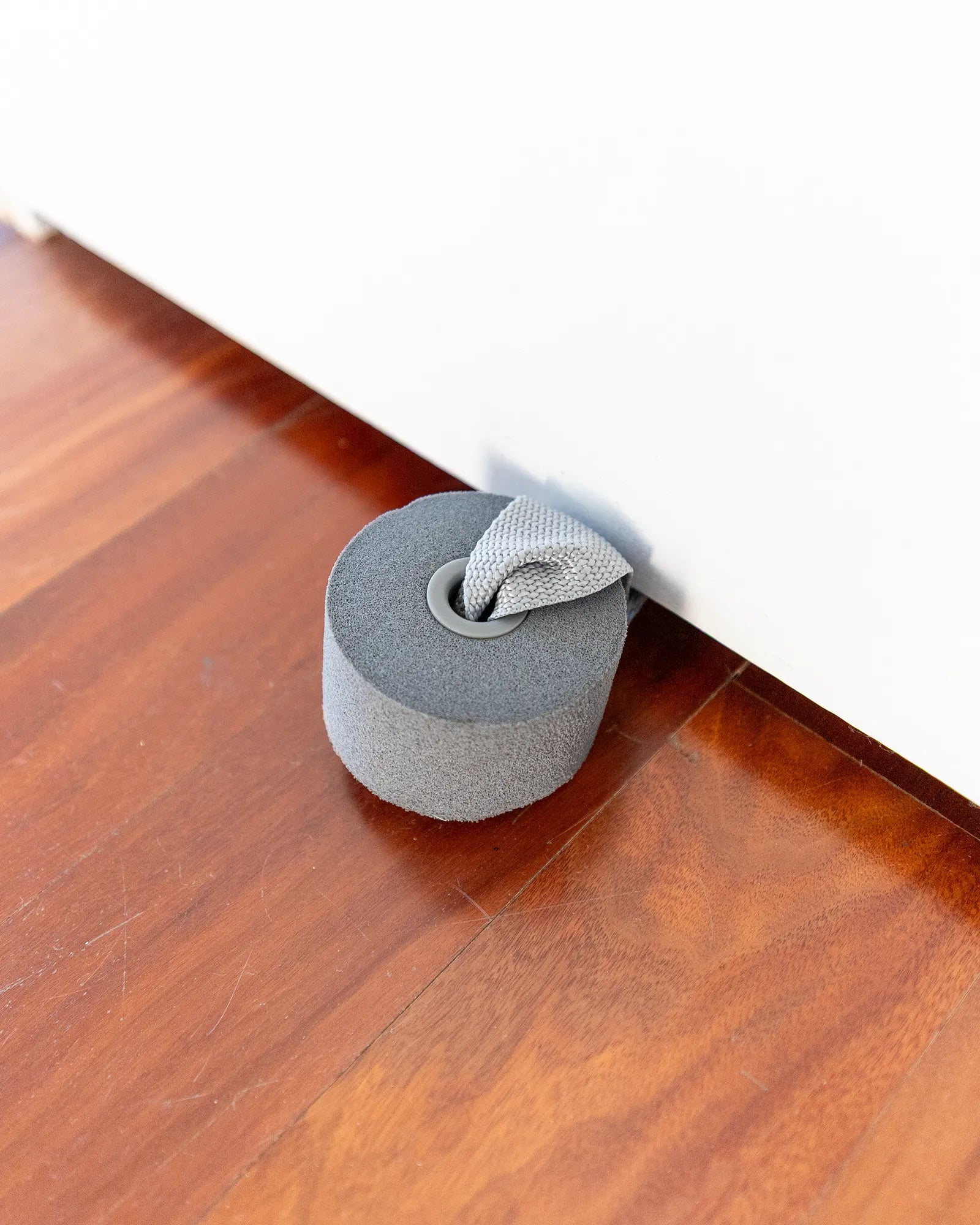 EQYP Power Tubes Door Anchor foam stopper wedged beneath a closed door