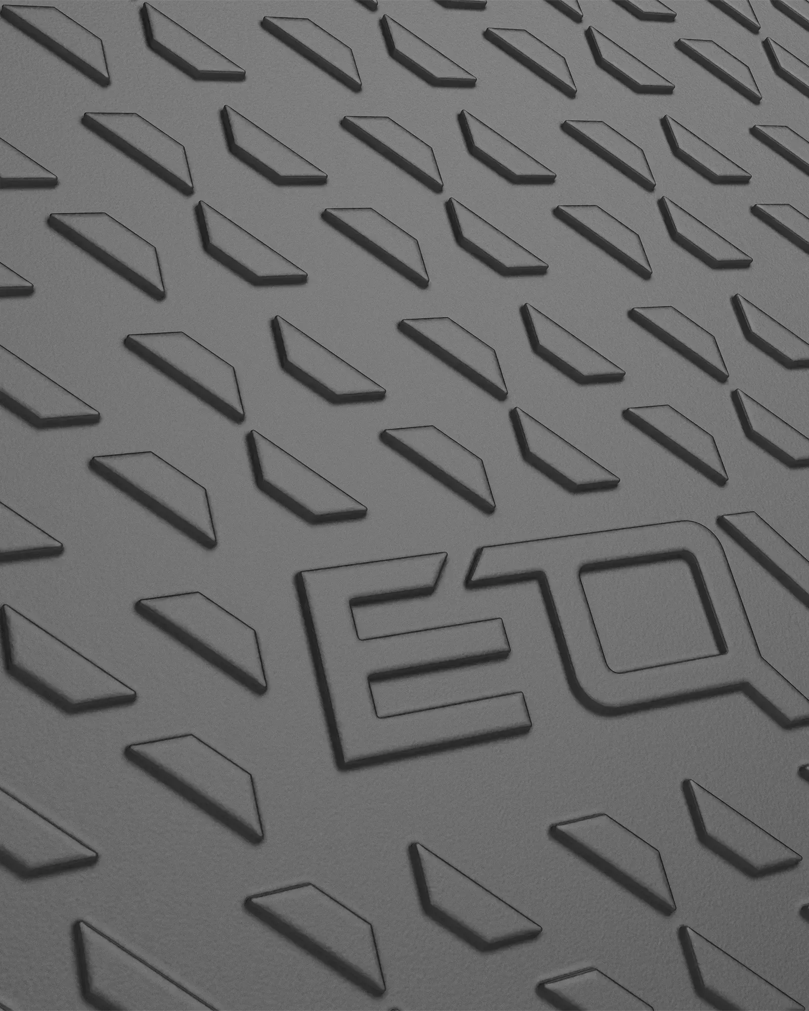Close-up of EQYP Sliding Disc dark gray textured surface showing embossed diamond pattern and EQYP logo