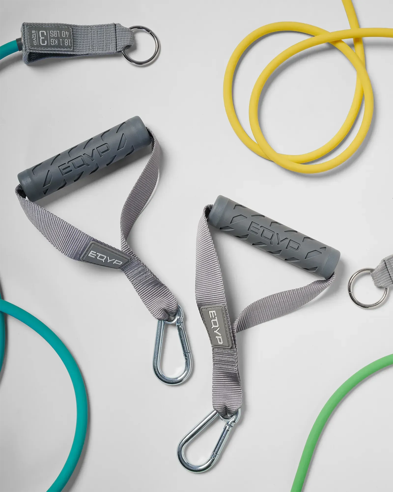 EQYP Power Tubes Handles laid flat alongside multiple colored resistance tubes