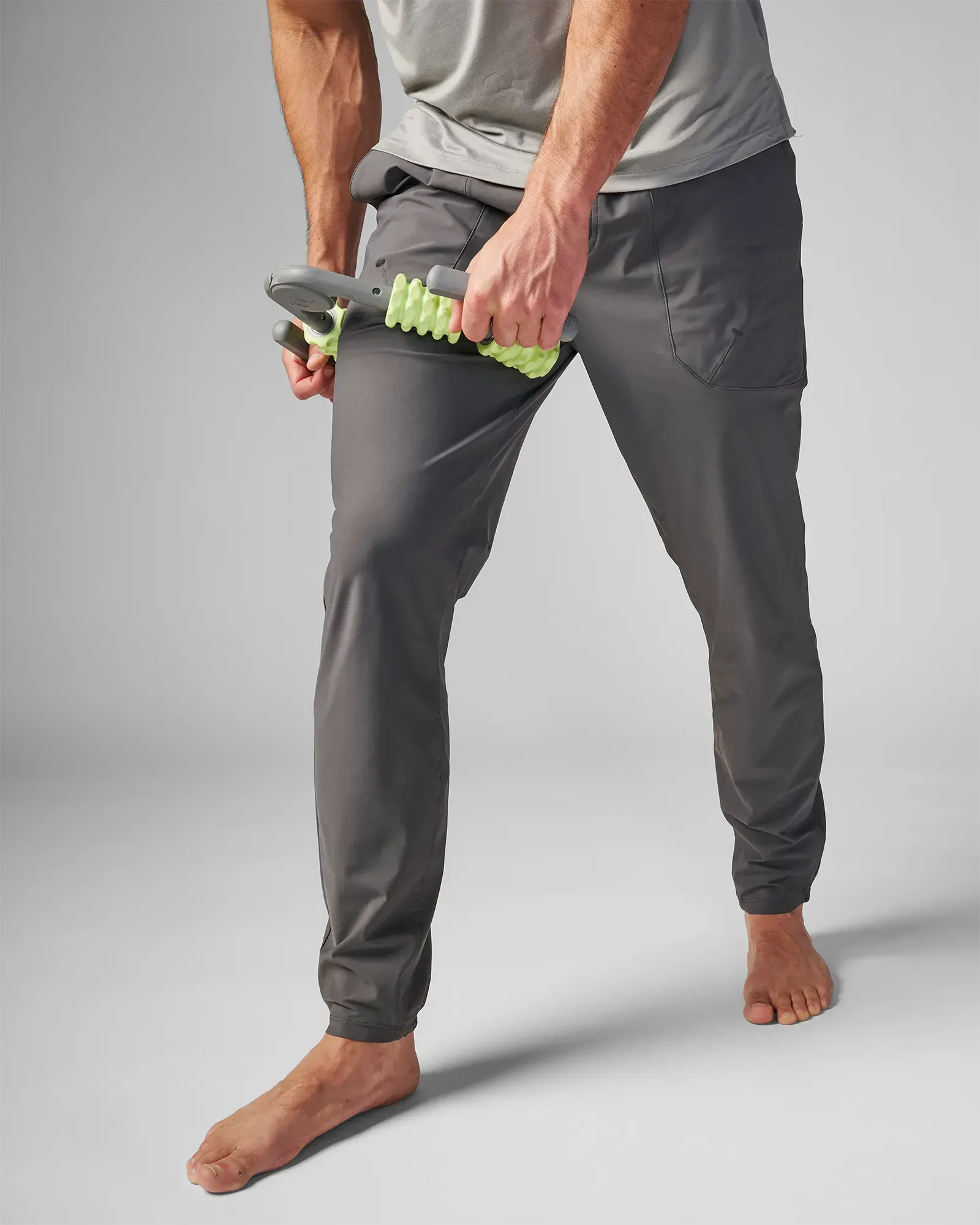 Man using muscle compressor with 4-point massage rollers on his leg