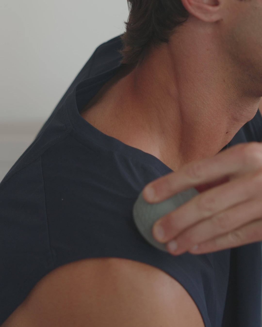 Video of man using using EQYP roll-on massager with textured outer shell