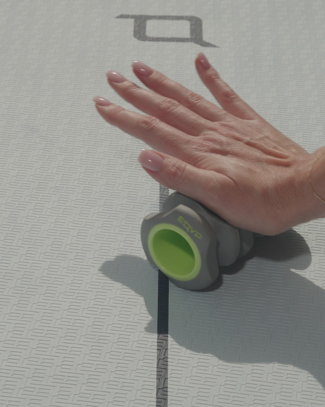Video of woman using foot and hand roller for massage and relief